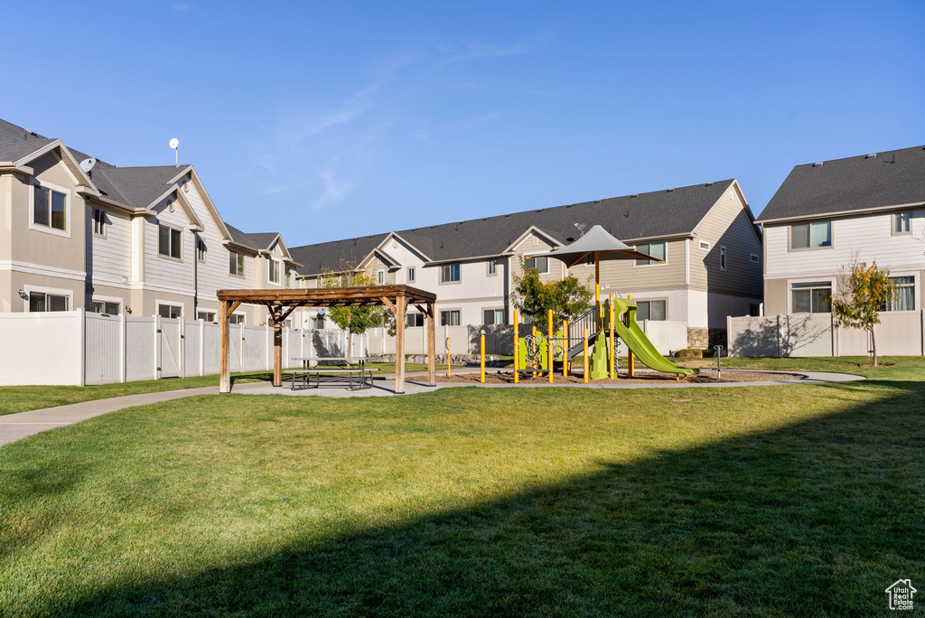 View of yard with a patio, a playground, and a pergola