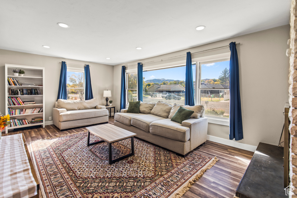 Living room with hardwood / wood-style flooring