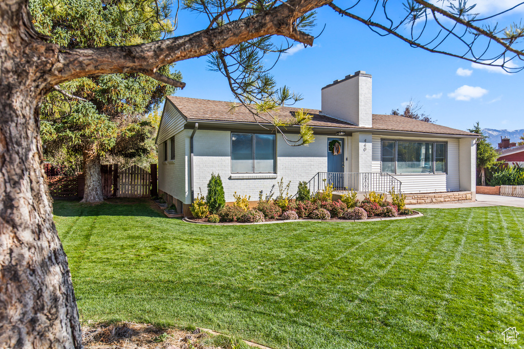 Ranch-style house with a front lawn