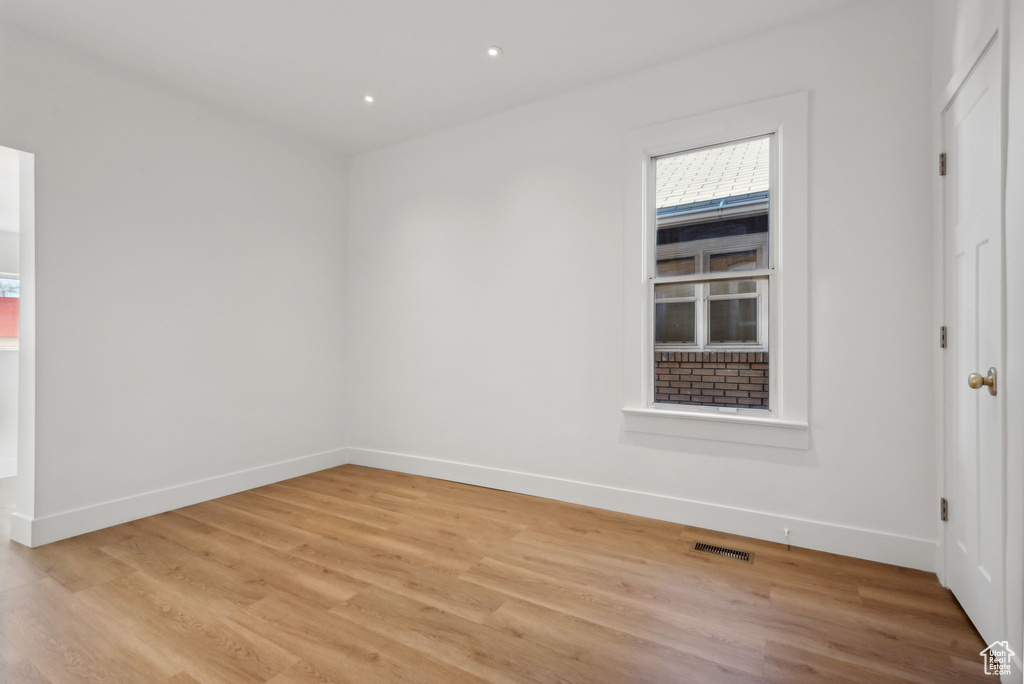 Empty room with light wood-type flooring