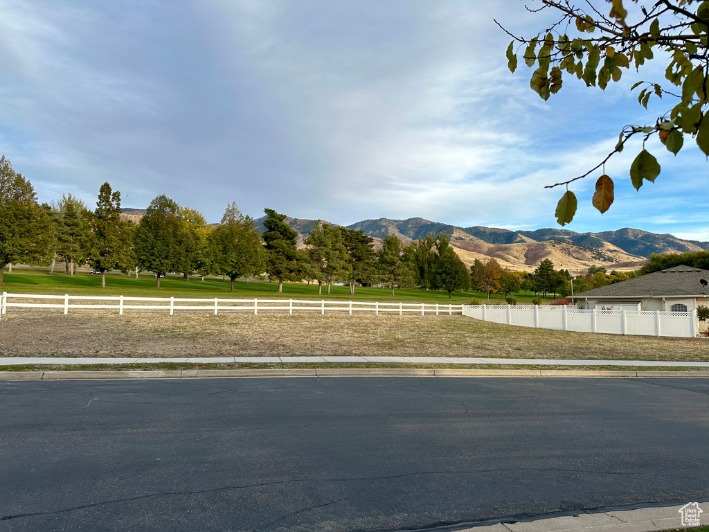 View of road with a rural view and a mountain view