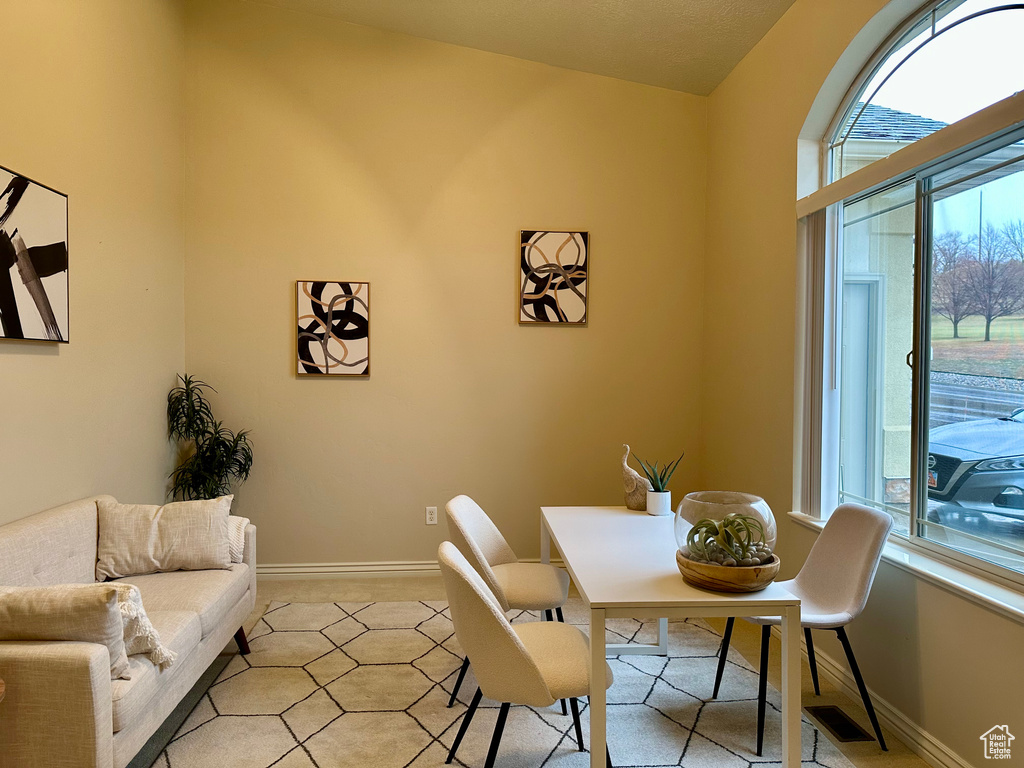 Dining room featuring vaulted ceiling