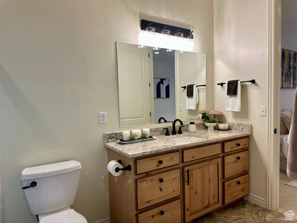 Bathroom with vanity and toilet