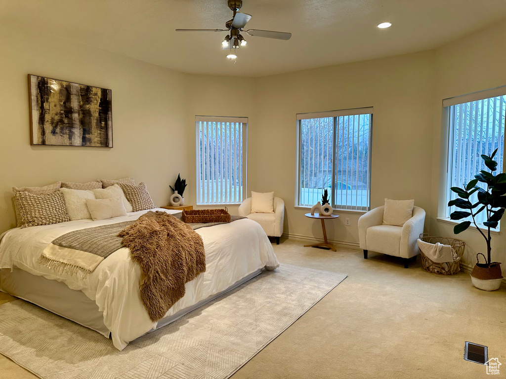 Bedroom featuring ceiling fan and carpet floors