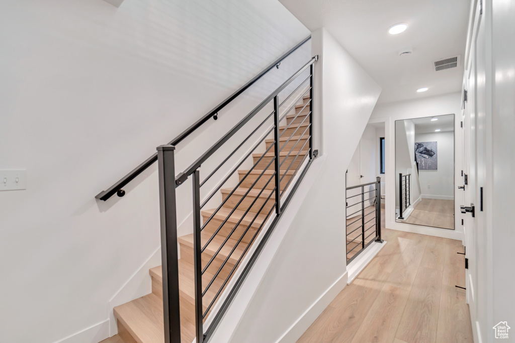 Stairway with hardwood / wood-style floors