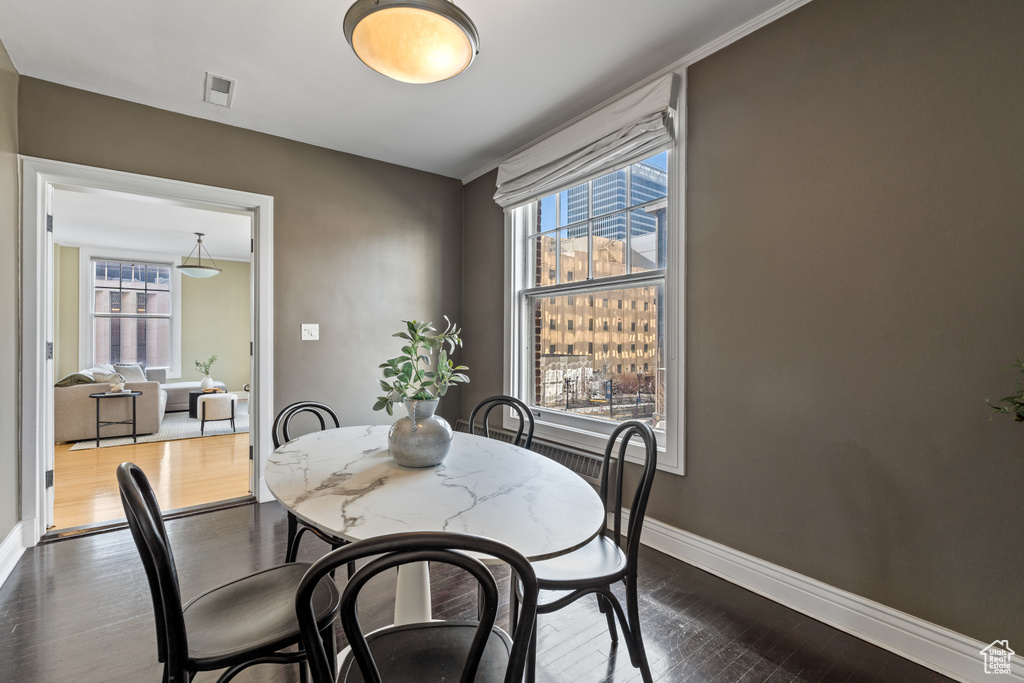Dining area featuring dark hardwood / wood-style flooring