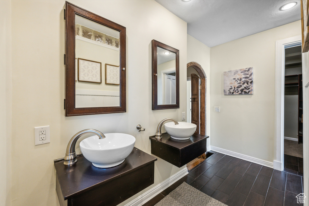 Bathroom with vanity and hardwood / wood-style floors
