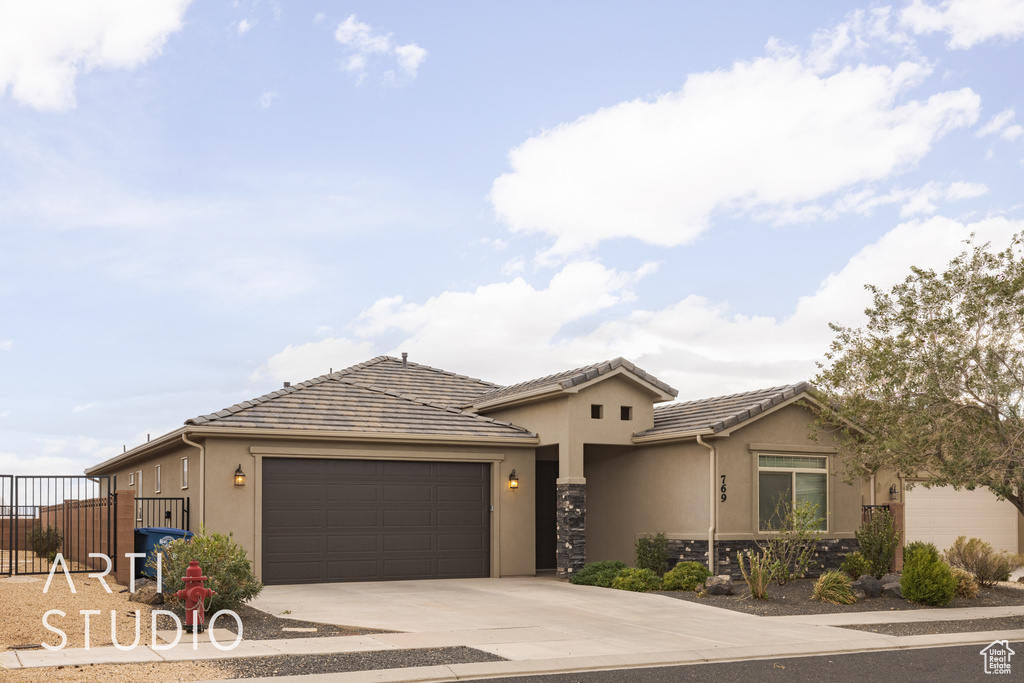 View of front facade featuring a garage