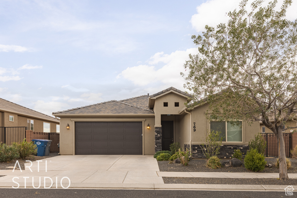 View of front of property featuring a garage