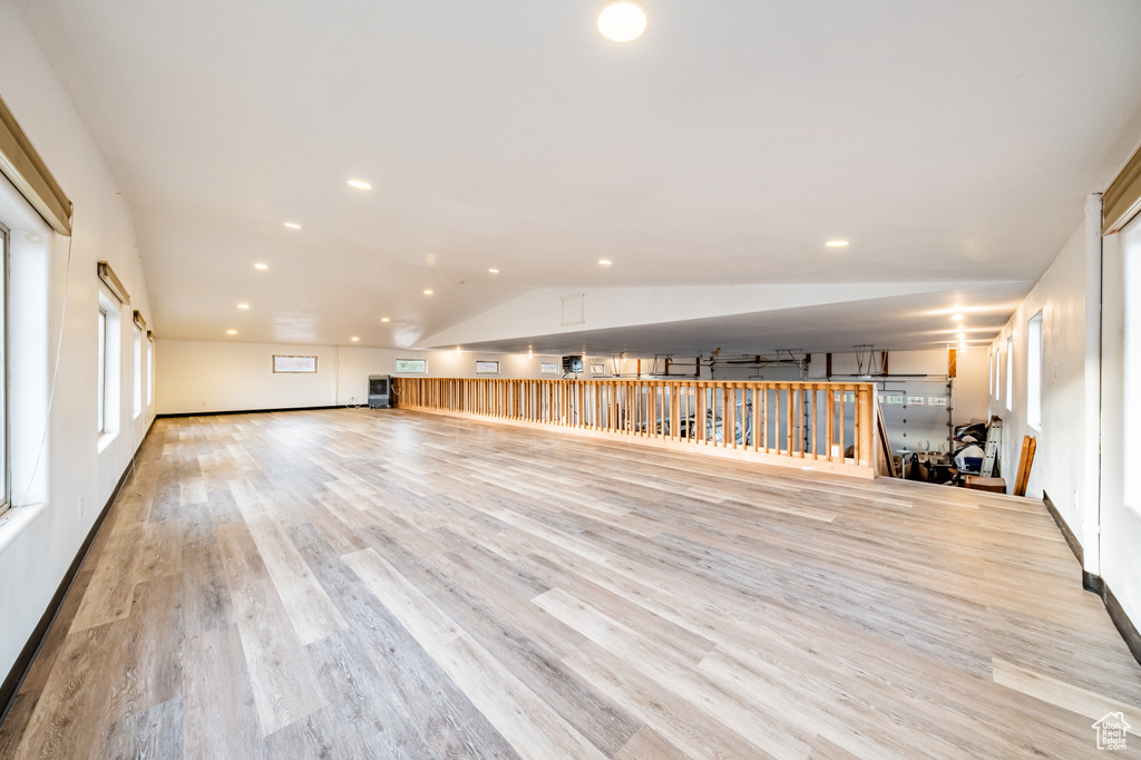 Interior space with lofted ceiling and light wood-type flooring