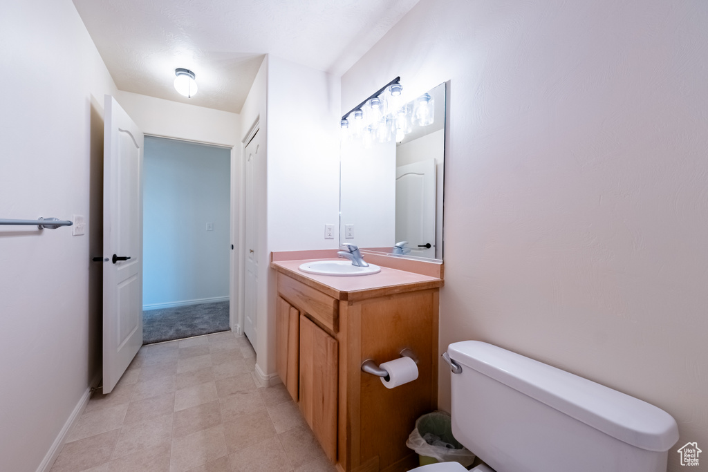 Bathroom with vanity and toilet