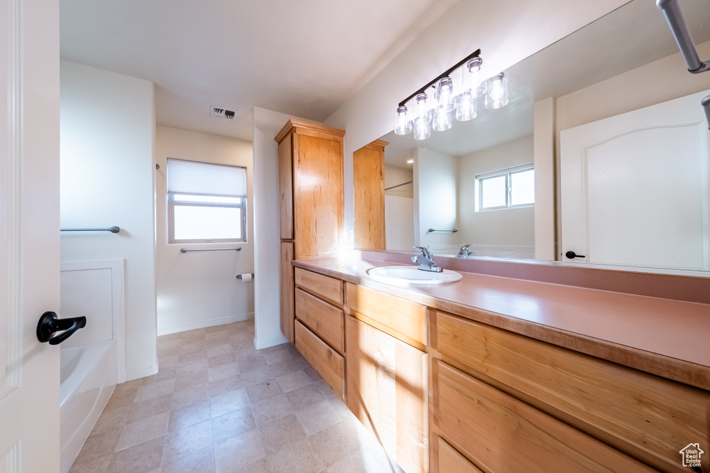 Bathroom with vanity and a bathtub