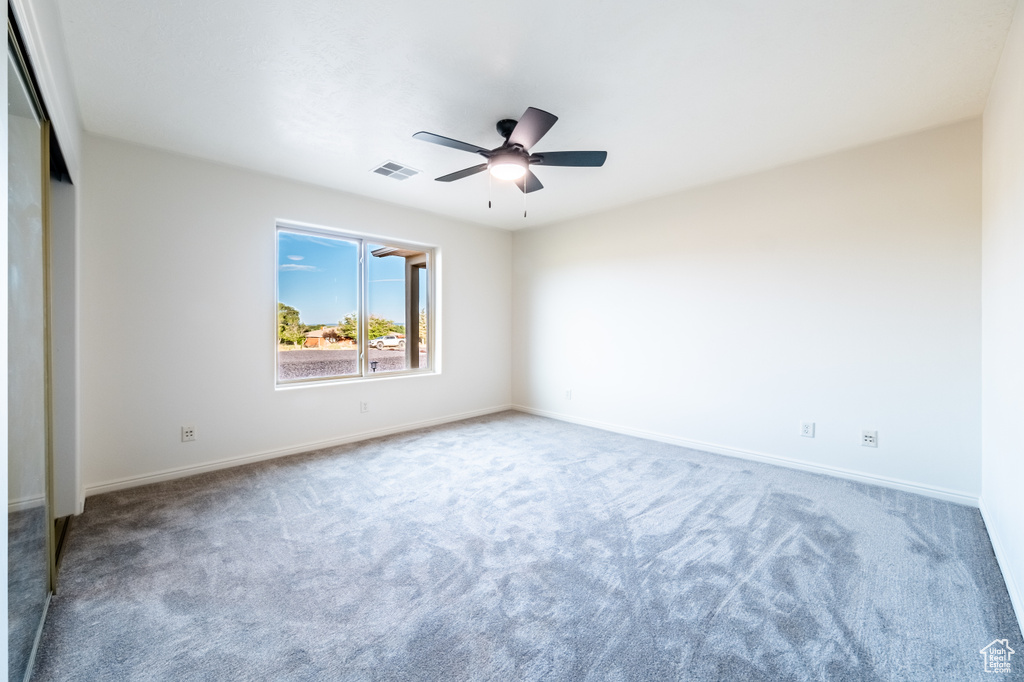 Unfurnished bedroom with carpet floors, a closet, and ceiling fan