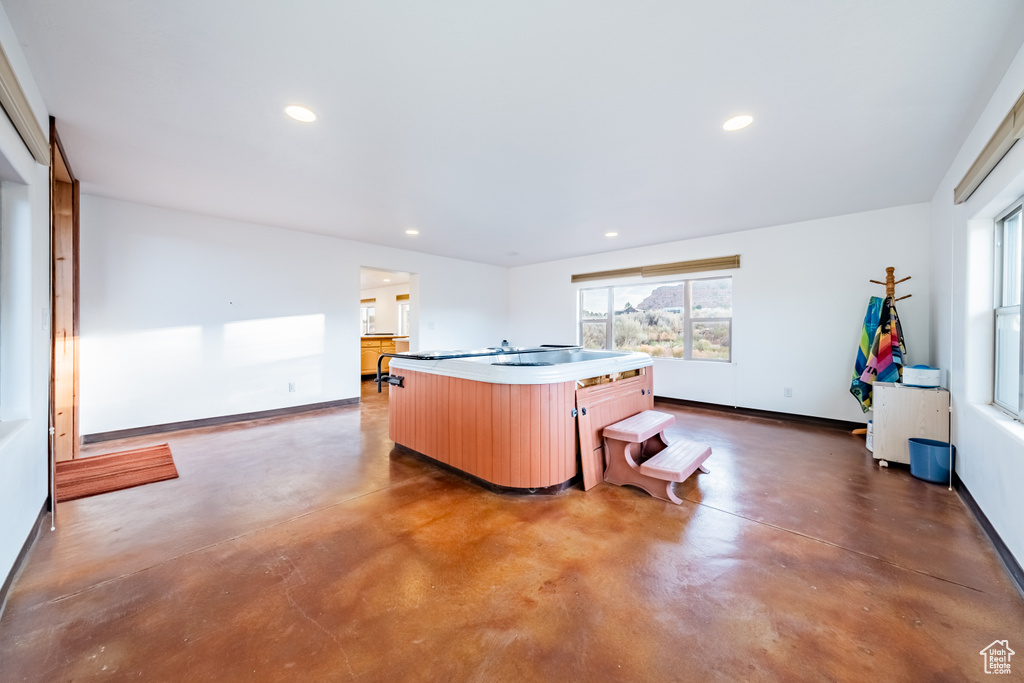 Kitchen featuring a center island with sink and stovetop