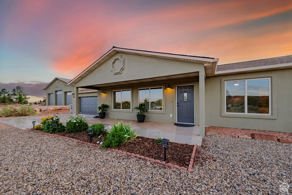 View of front of property with a garage