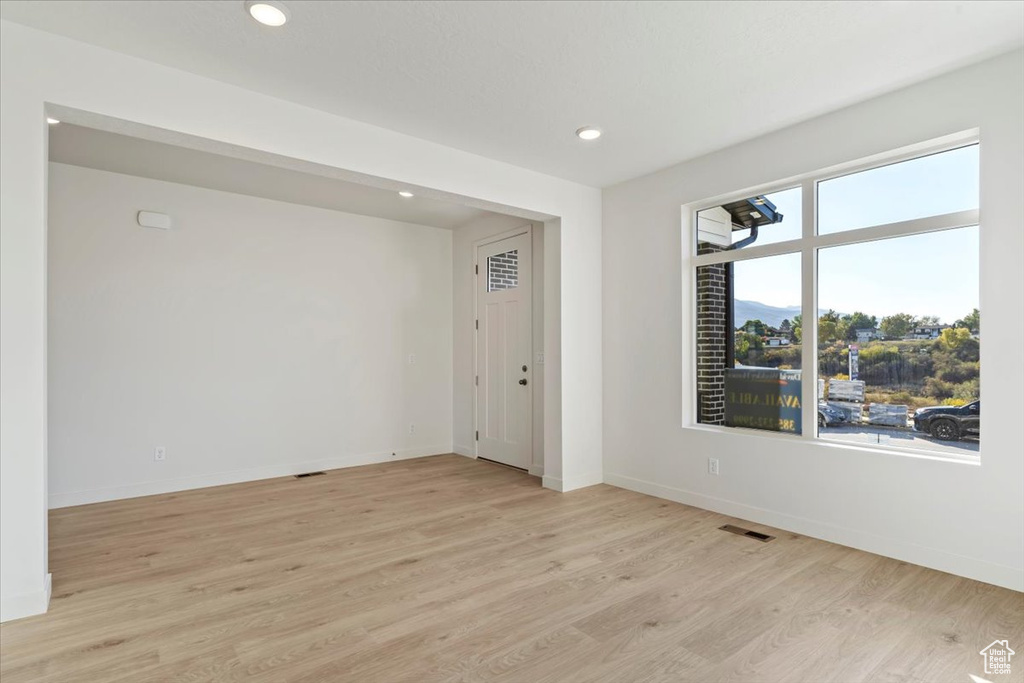 Empty room featuring light hardwood / wood-style floors