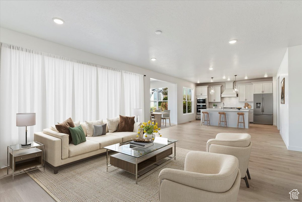 Living room with light wood-type flooring