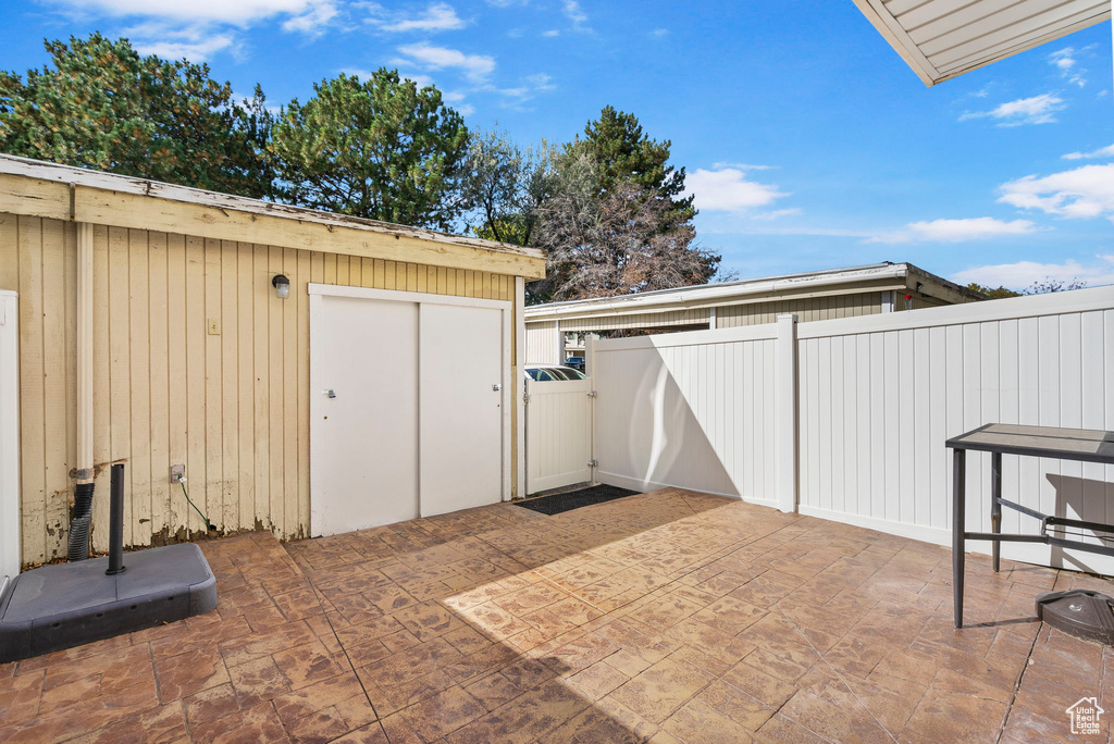 View of patio / terrace featuring a shed