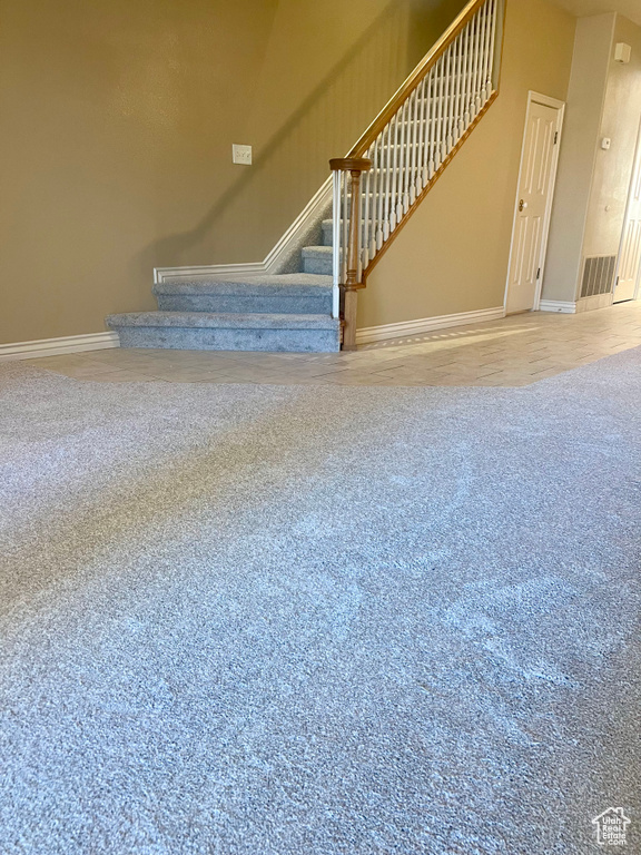 Unfurnished living room featuring carpet flooring