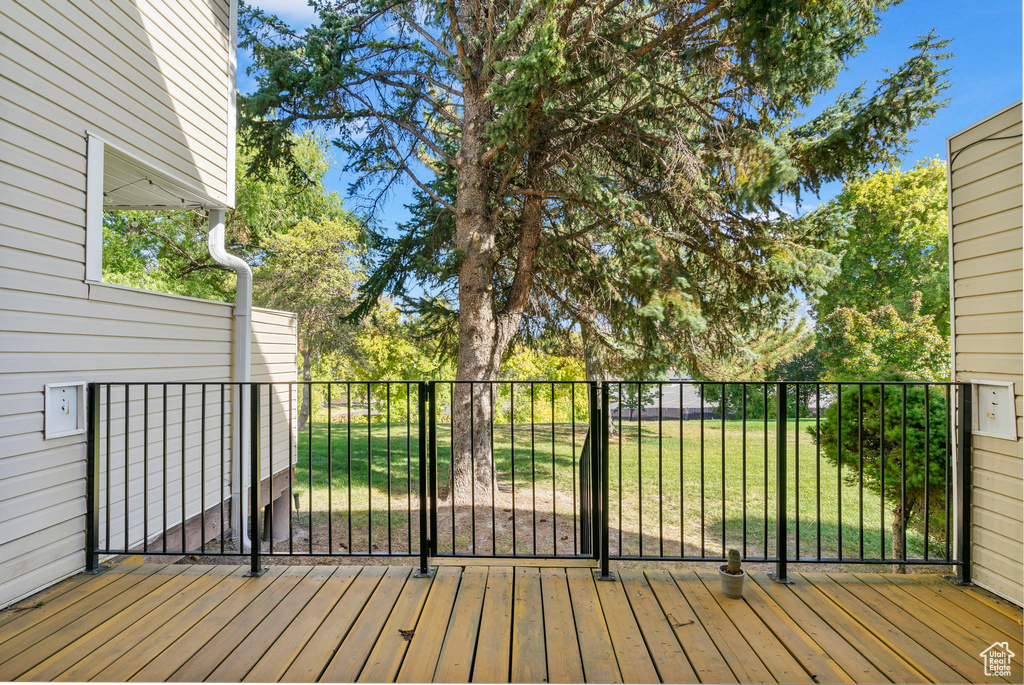 Deck featuring a lawn