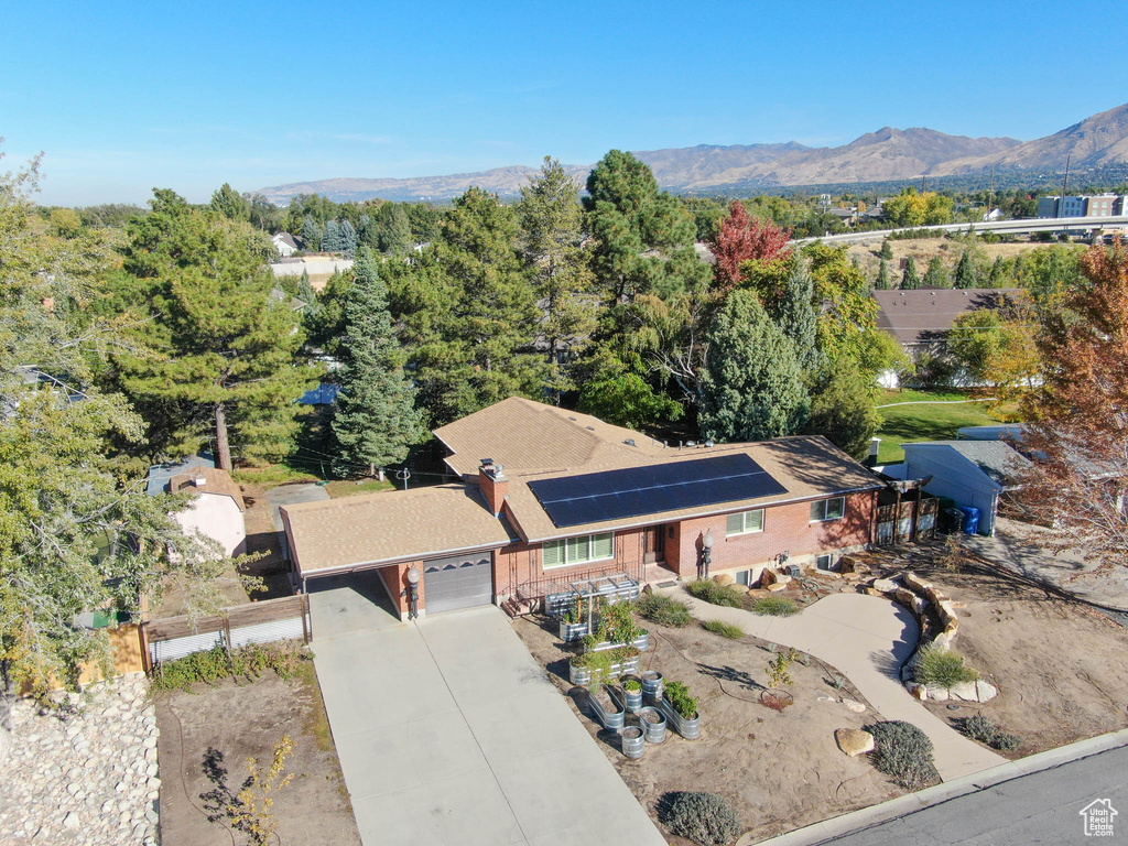 Birds eye view of property with a mountain view