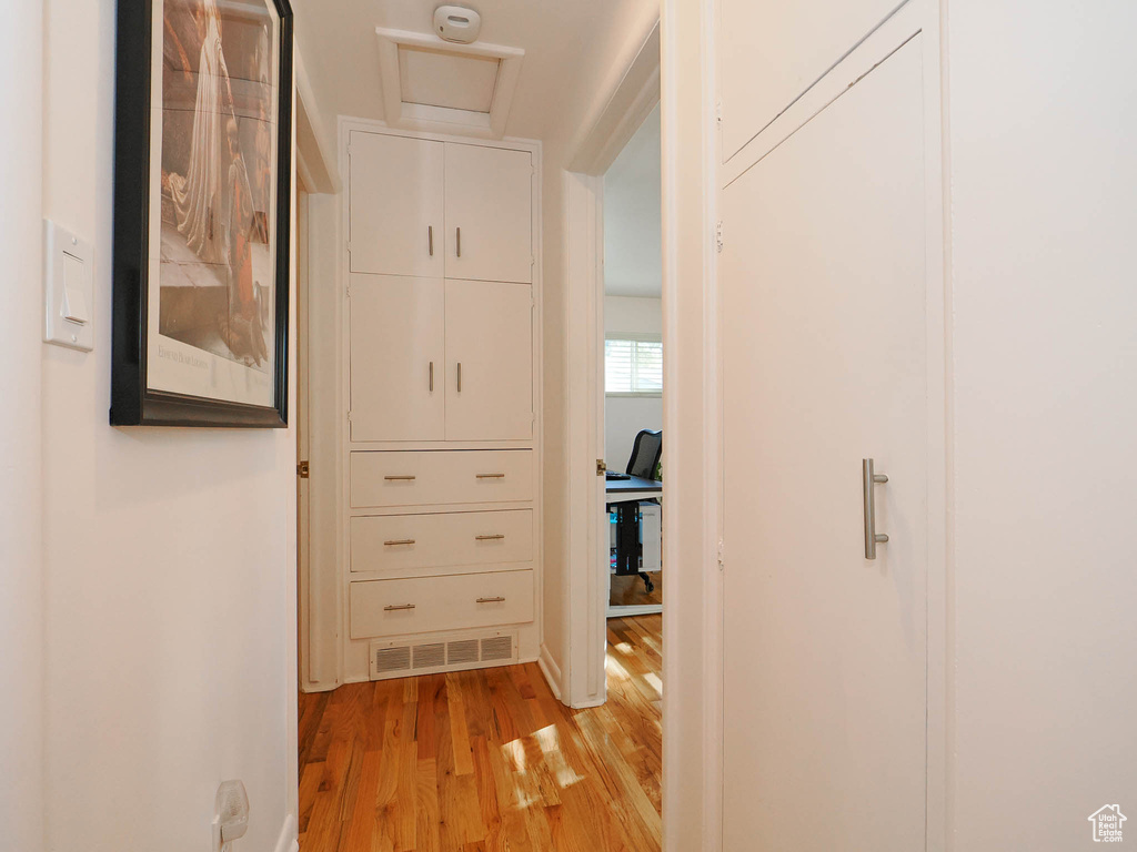 Hallway with light wood-type flooring