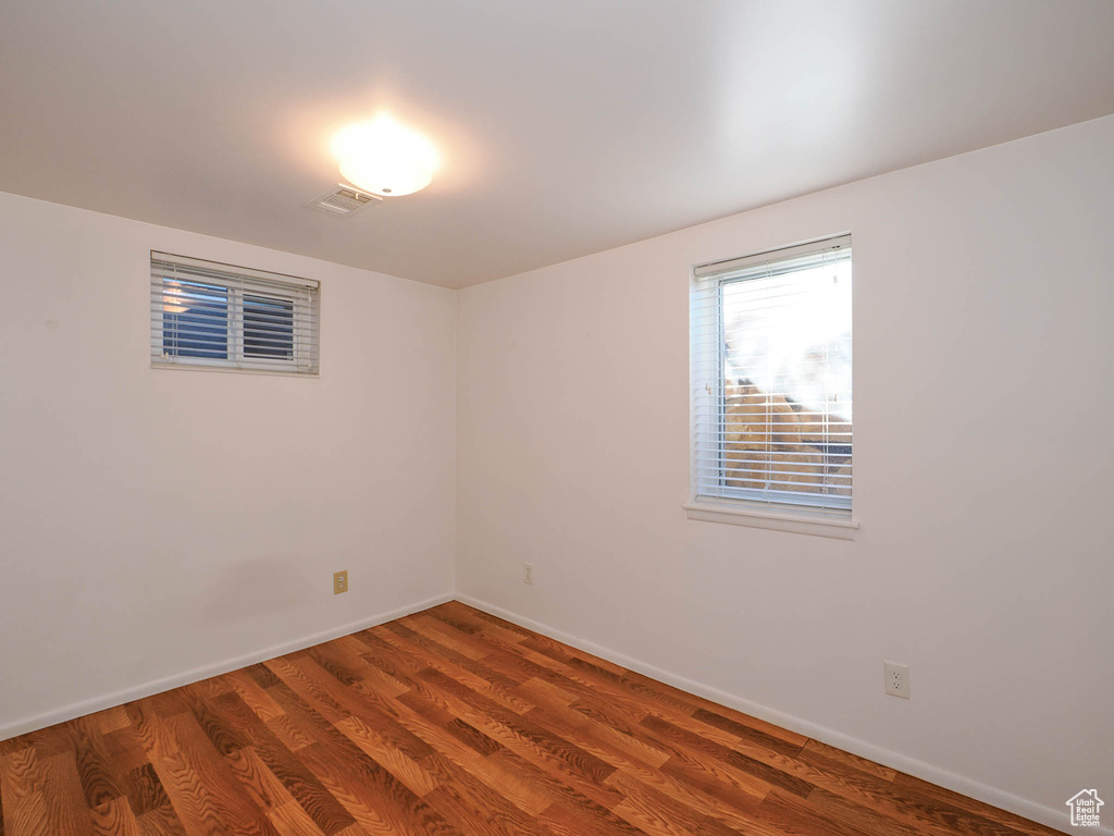 Empty room featuring hardwood / wood-style floors