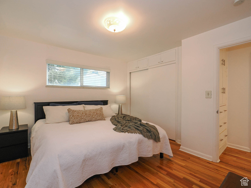 Bedroom featuring hardwood / wood-style flooring and a closet