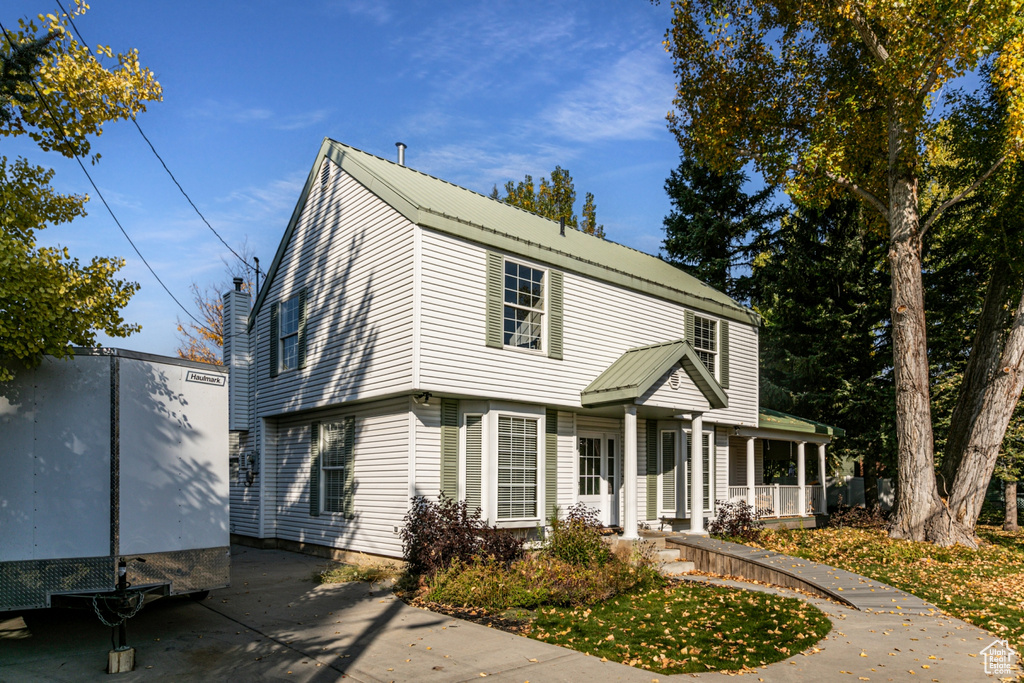 View of front property featuring a porch