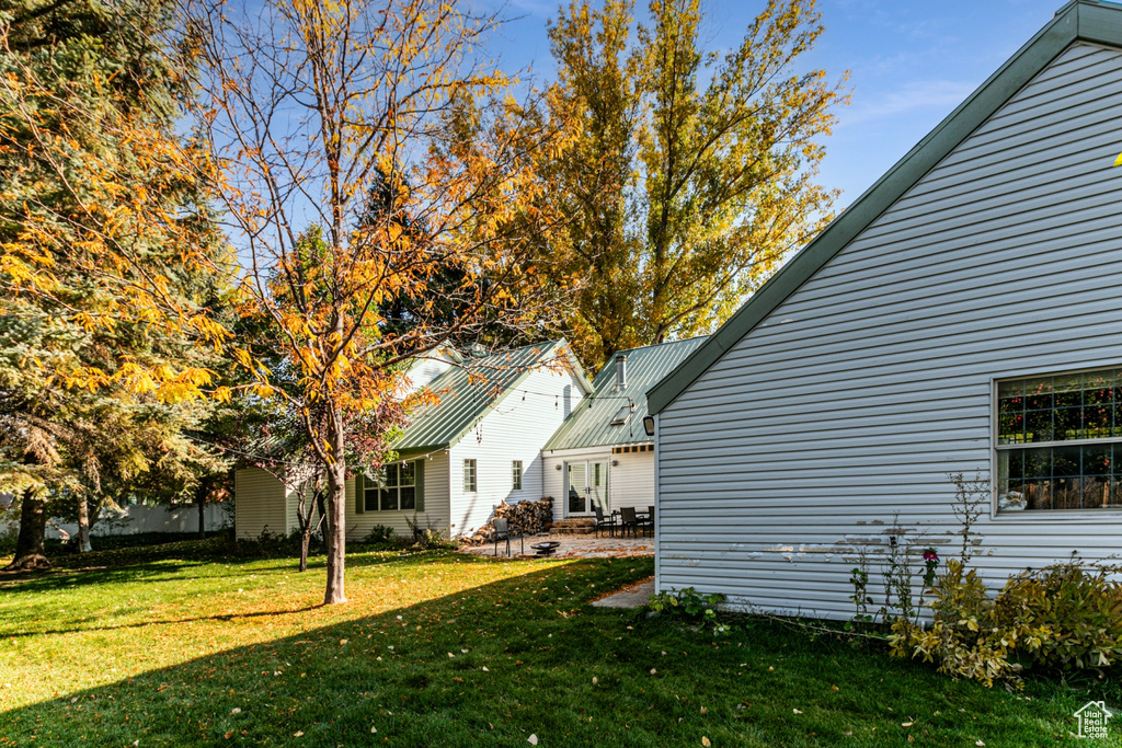 View of yard with a patio