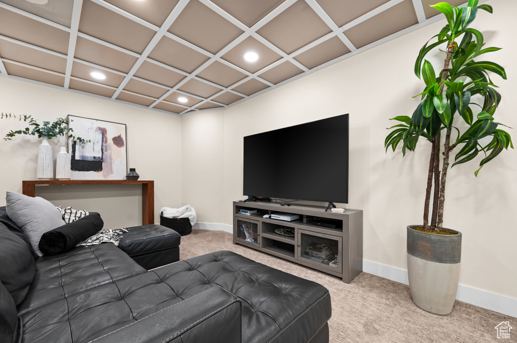 Living room with carpet and coffered ceiling