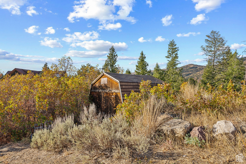 View of outbuilding featuring a mountain view