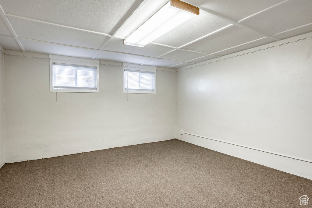 Basement with carpet flooring