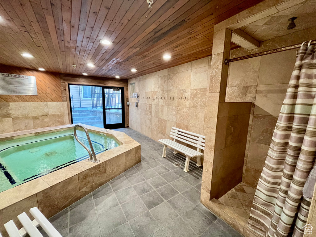 View of pool featuring an indoor hot tub