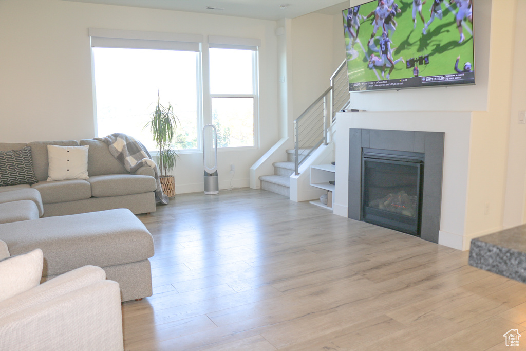 Living room with light wood-type flooring