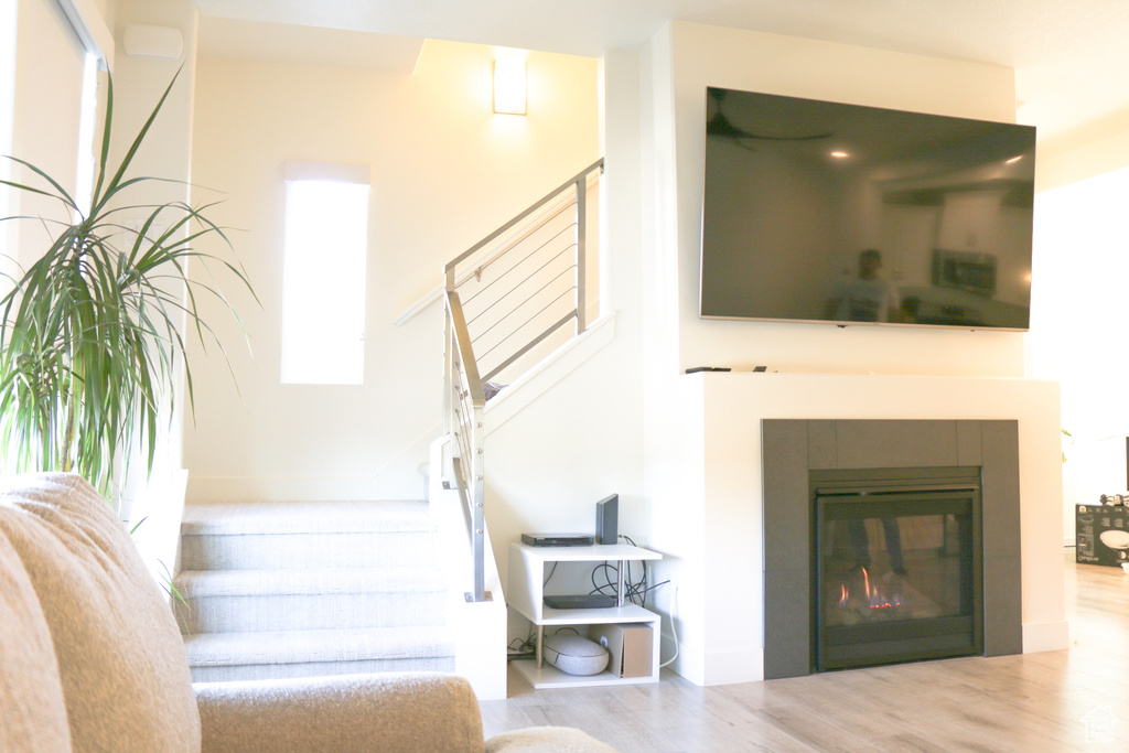 Living room with hardwood / wood-style flooring