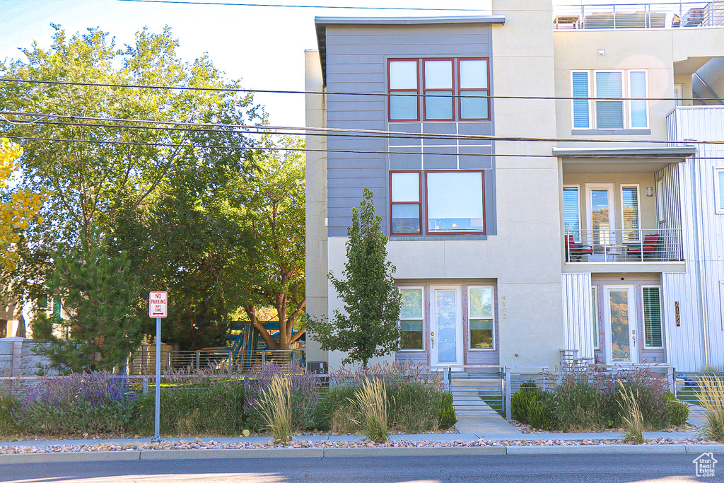 View of front of home with a balcony