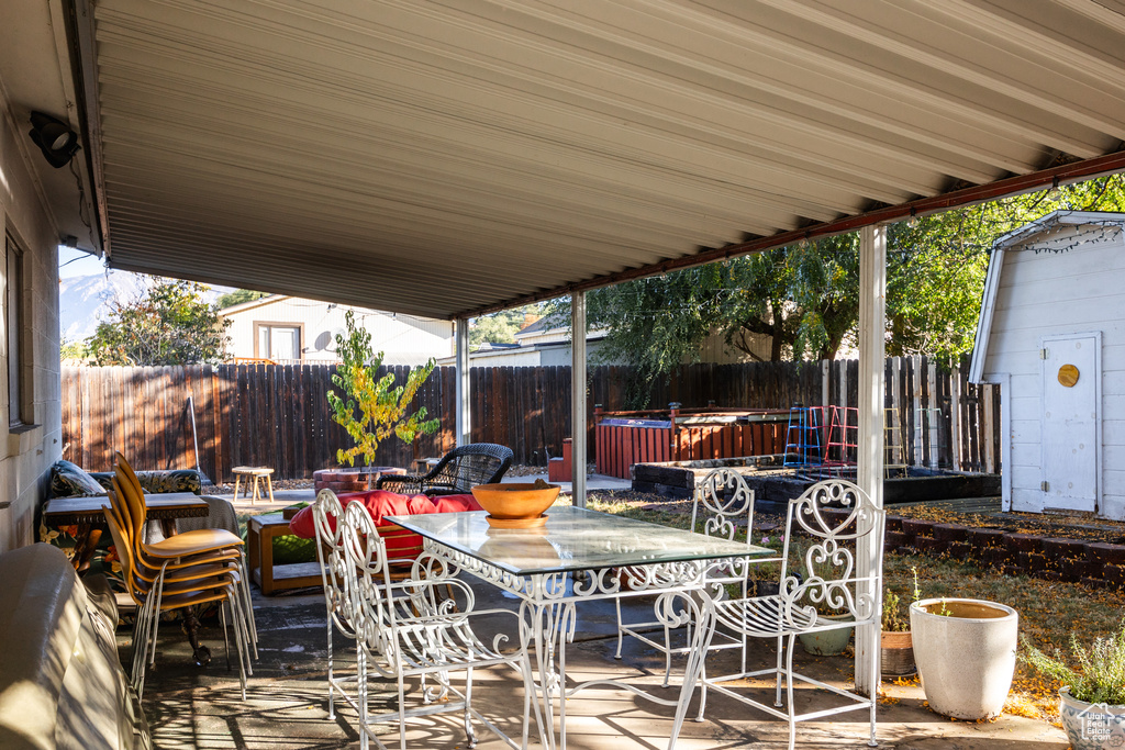 View of patio / terrace featuring a jacuzzi