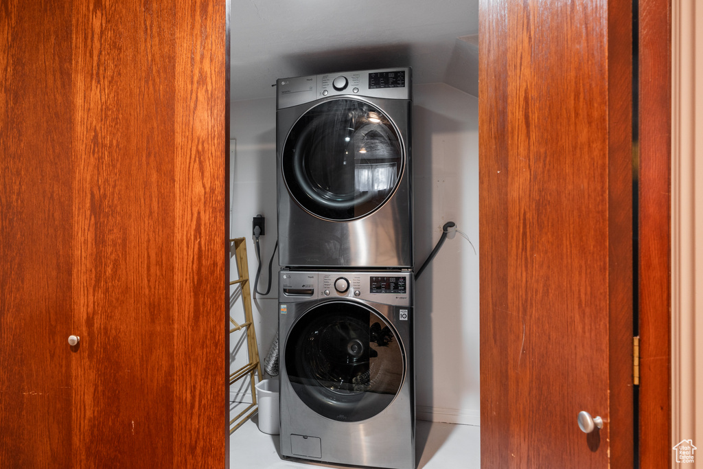 Laundry room featuring stacked washer / dryer