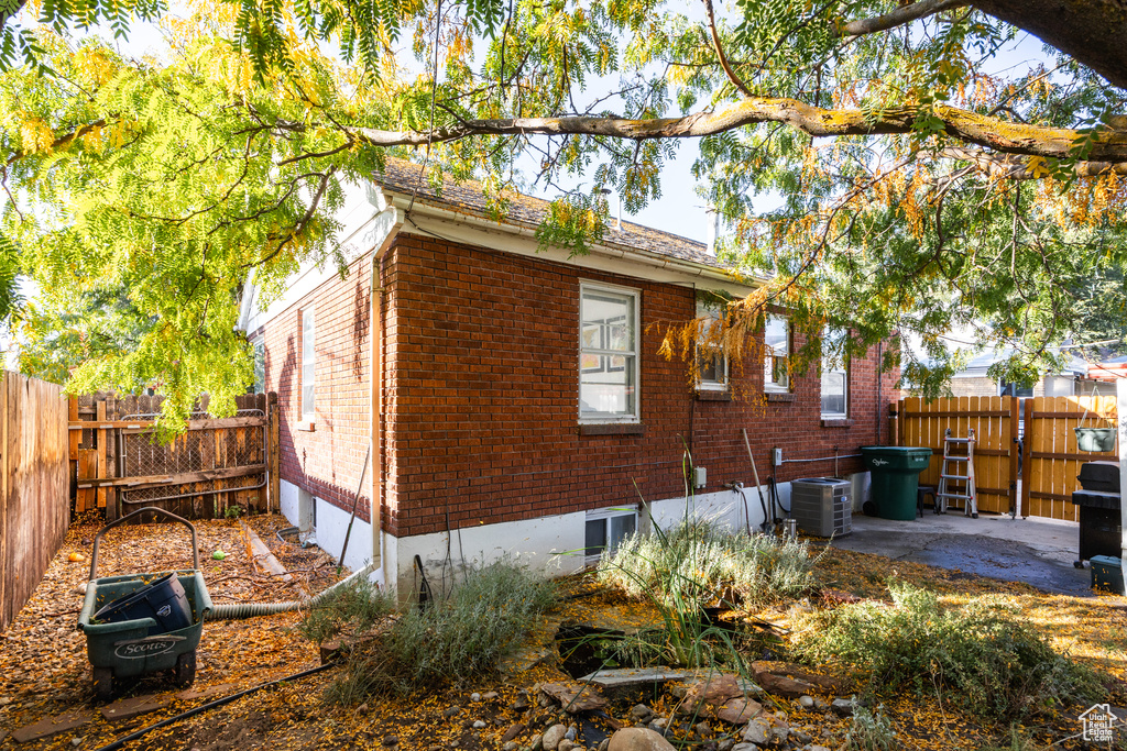 View of side of home featuring a patio and central AC unit