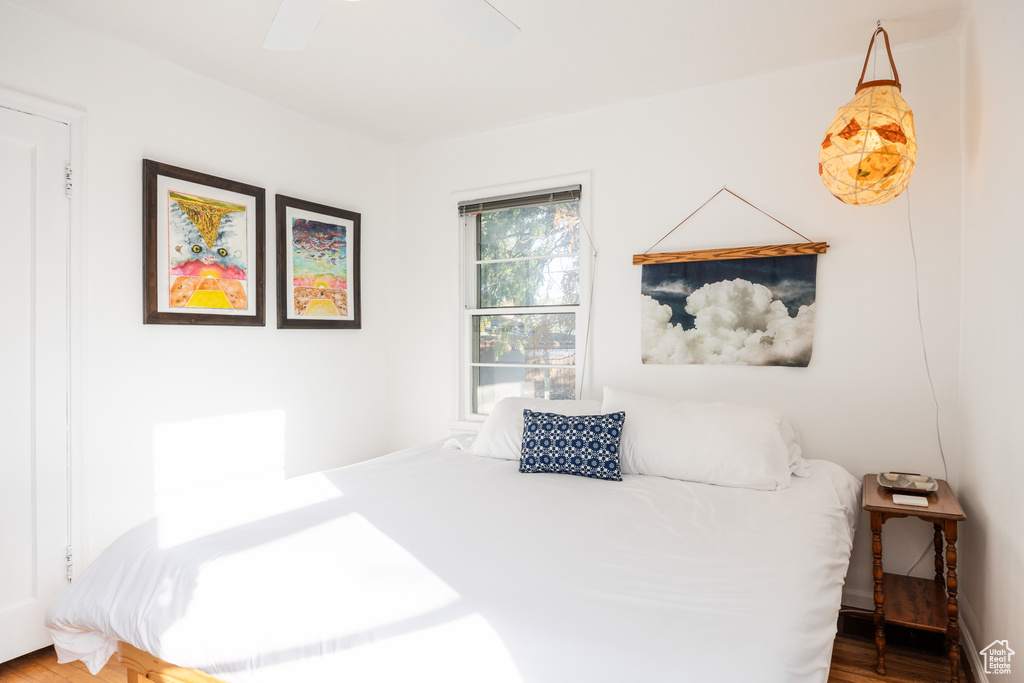 Bedroom featuring ceiling fan and wood-type flooring