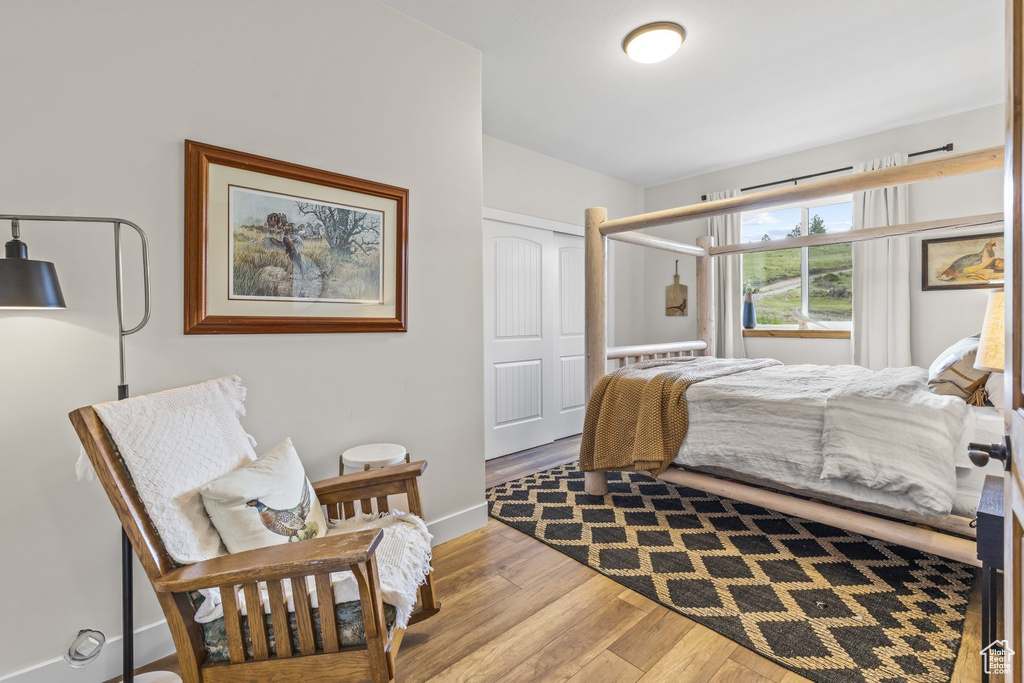 Bedroom featuring a closet and light hardwood / wood-style floors