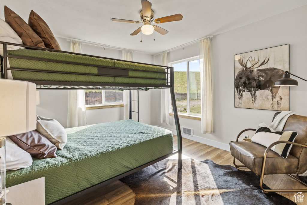 Bedroom with wood-type flooring and ceiling fan