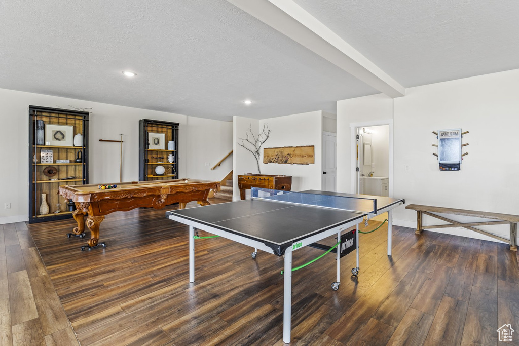 Recreation room with billiards, a textured ceiling, and dark hardwood / wood-style flooring