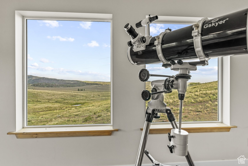 Room details featuring a mountain view and a rural view