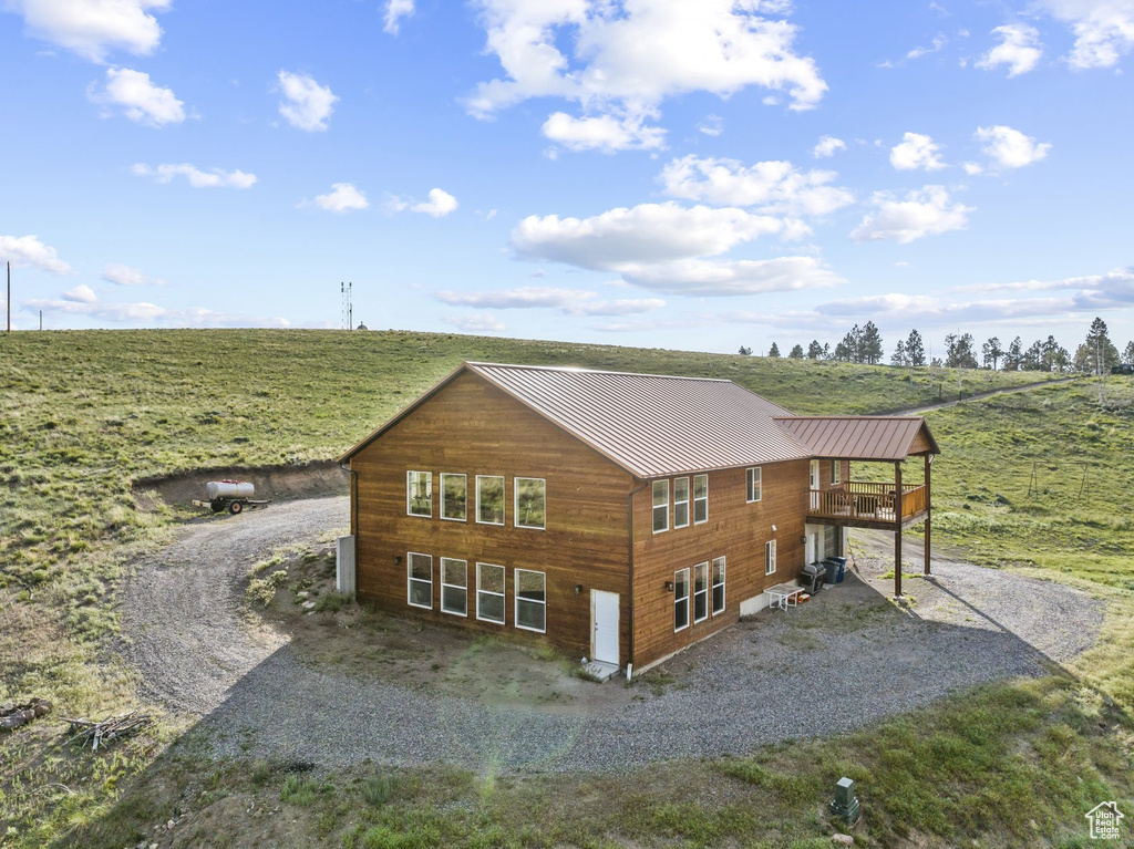 Exterior space featuring a balcony and a rural view