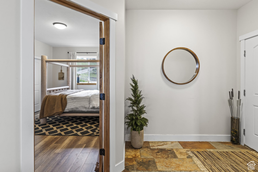 Interior space with dark hardwood / wood-style floors