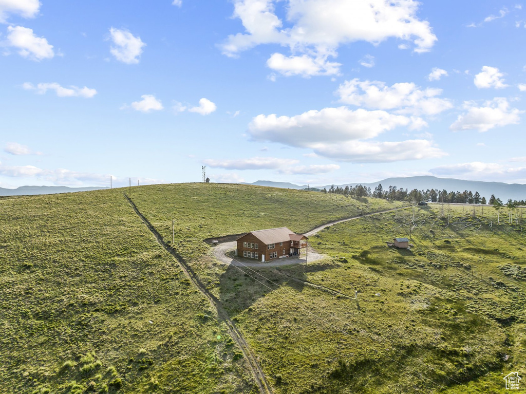 View of yard with a mountain view and a rural view