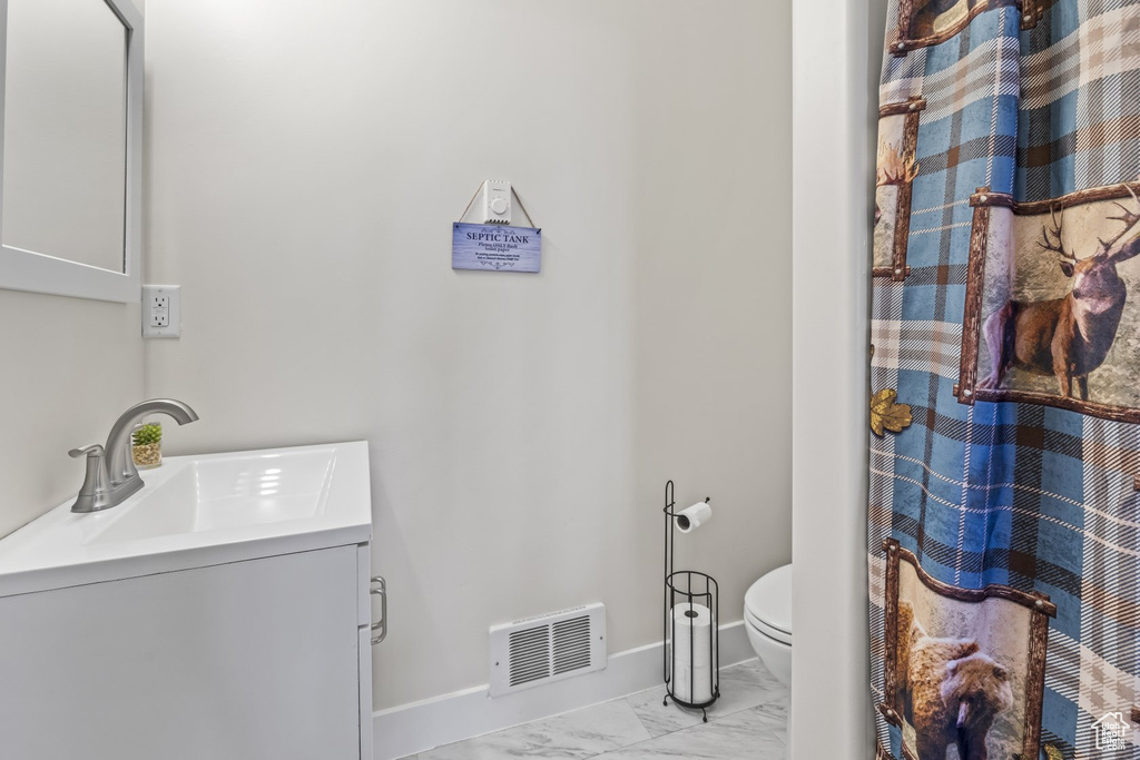 Bathroom with toilet and vanity