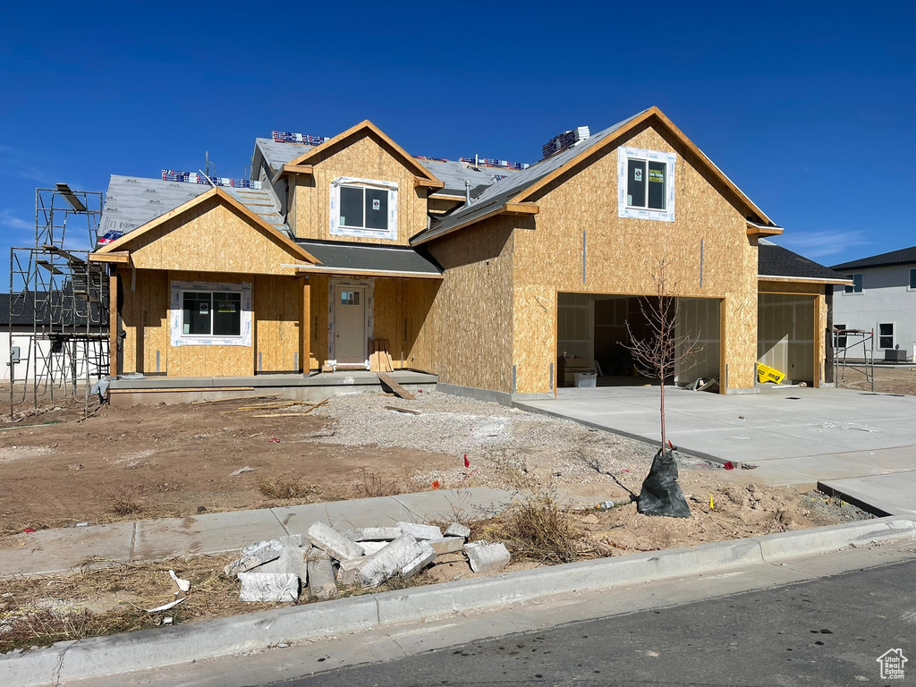 Property under construction with a garage